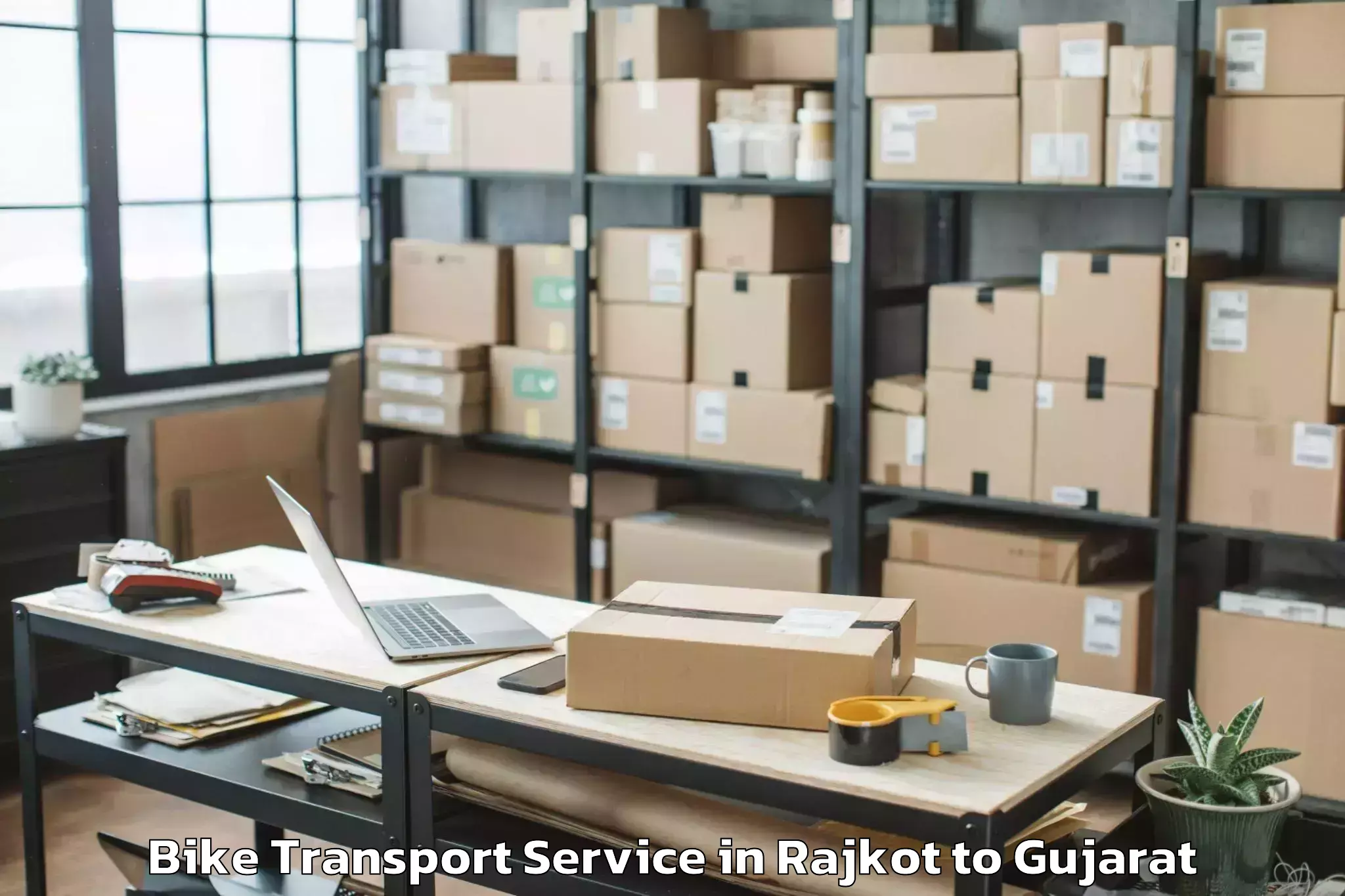 Book Rajkot to Tilakvada Bike Transport Online